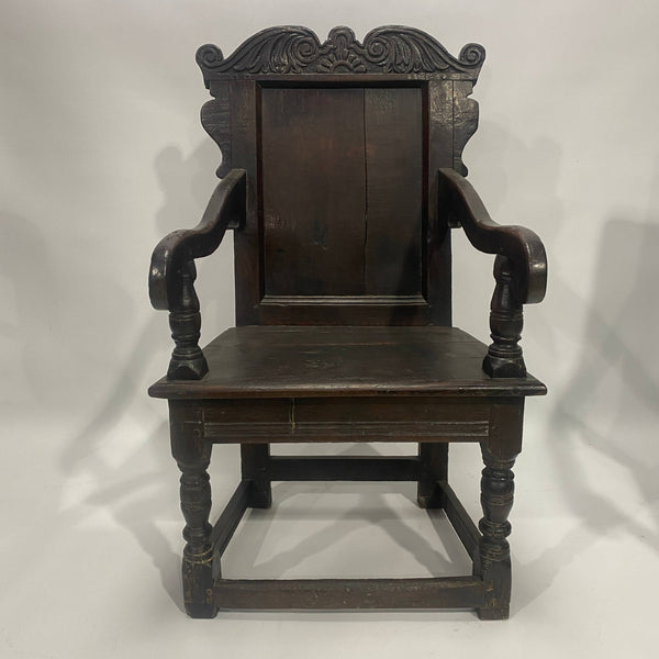 17th Century Oak Wainscot Armchair, carved and inlaid back panel and turned legs