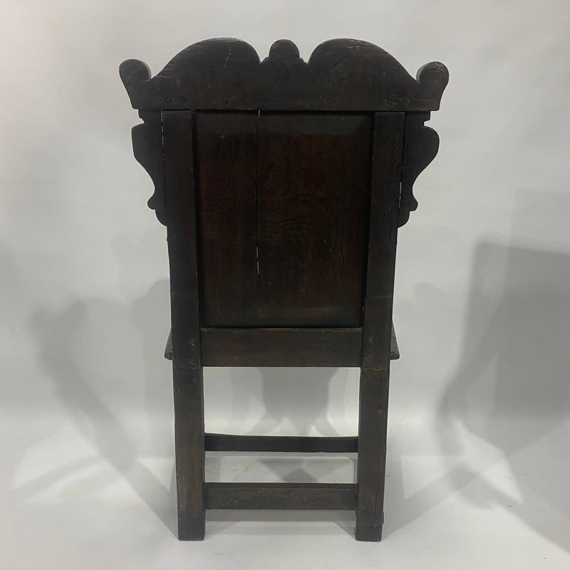 17th Century Oak Wainscot Armchair, carved and inlaid back panel and turned legs